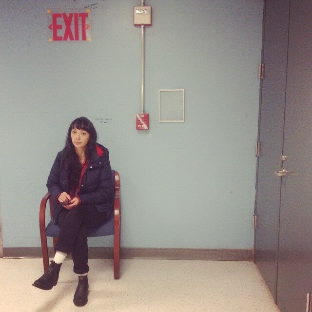Claire being forced to sit down.