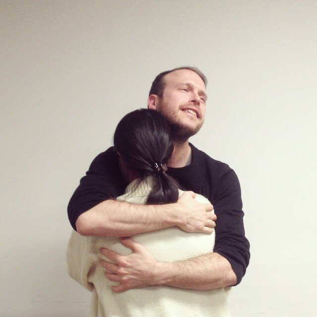 Brian giving Jayati a hug for a piece of chocolate.